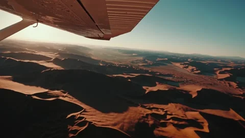 Aerial view from an airplane of dunes in Namibia Africa Stock Footage 299944785