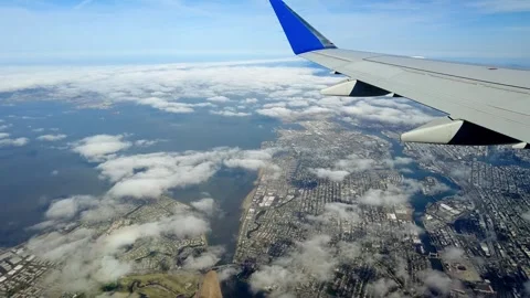 Aerial view from an airplane flying over Oakland and Alameda, California Video stock 313090187