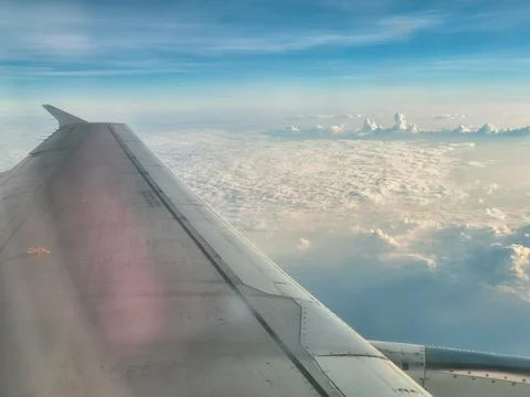 Aerial view of airplane jet engine flying high Stock Photos