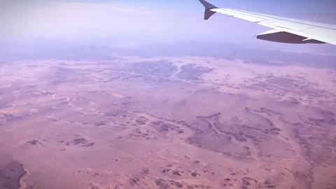 Aerial view from airplane showing desolate desert in Alula, Saudi Arabia Stock Footage 277230775