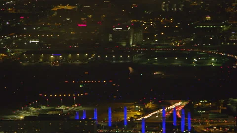 Aerial view of airplane taking off on a cloudy night in Los Angeles, California. Stock-Footage 199459684