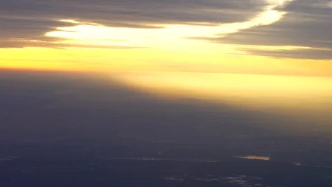 Aerial view from an airplane window during Sunset hours Stock Footage 107941659