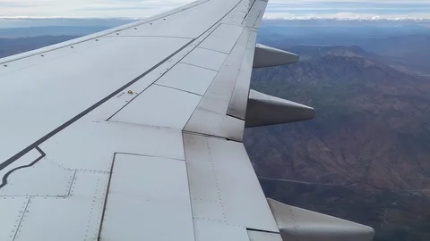 Aerial View From Airplane Window, Flying Above the Mountains Stock Footage 108814101