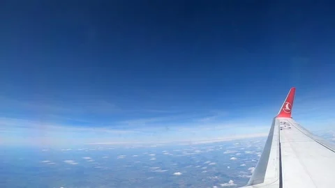 Aerial view from airplane window flying above thick white clouds Stock Footage 337060649