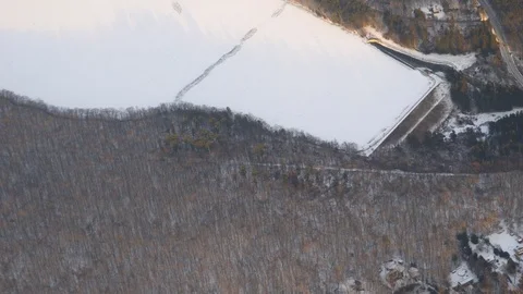 Aerial view from an airplane window looking down at winter landscape Stock Footage 107941764