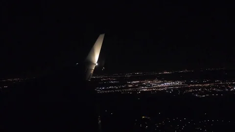 Aerial view from airplane window over night city lights Stock Footage 83772590