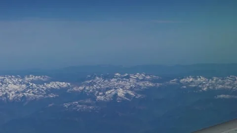 Aerial view from airplane window wing. Pyrenees with snow covered mountains-Dan Stock Footage 134278221