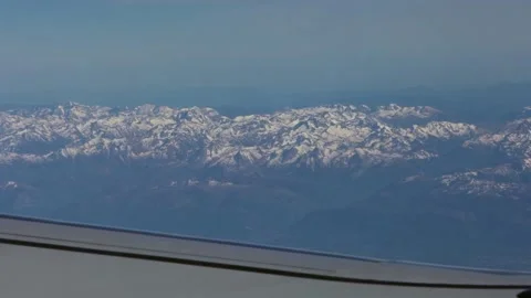 Aerial view from airplane window wing. Pyrenees with snow covered mountains-Dan Stock Footage 134278238
