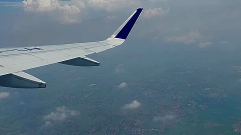 Aerial View from Airplane Wing with Clouds Stock Footage 280490069