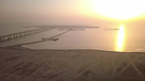 Aerial View of Al Khobar Beach and Causeway During Sunrise Stock Footage 336571856