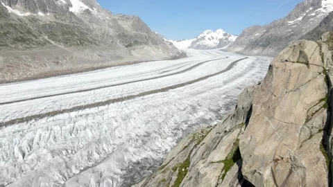 Aerial view of the Aletsch Glacier with a view towards the swiss alps Stock Footage 164615810