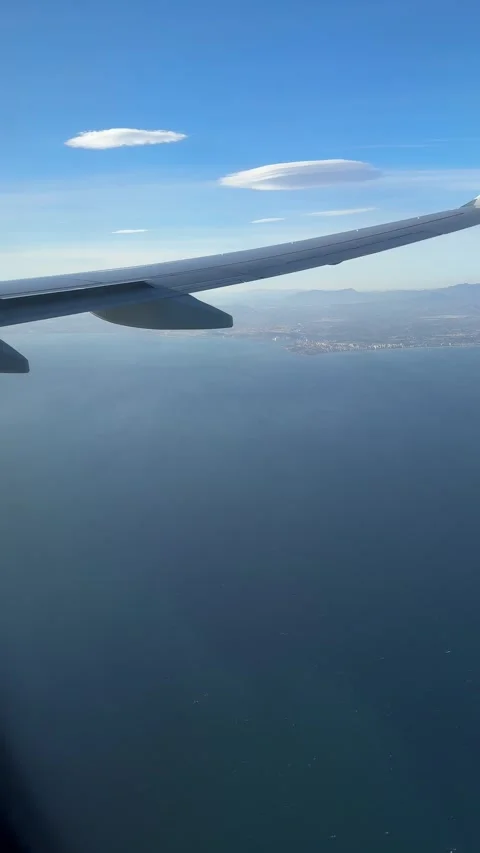 Aerial view of Alicante featuring its coastline seen through an airplane wing Stock Footage 294103175