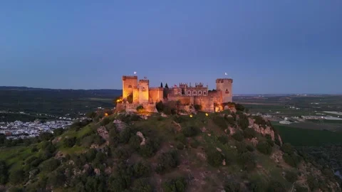 Aerial view of Almodovar Castle lights turning on at dusk, Spain Stock Footage 332552893