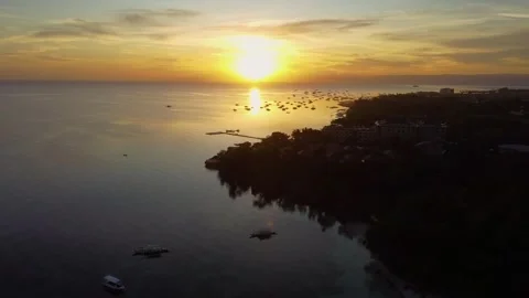 Aerial view of alona beach sunset over the ocean in bohol philippines Stock Footage 342575399