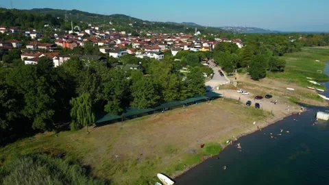 Aerial View Along Main Road Through Coastal Town Stock Footage 342345957