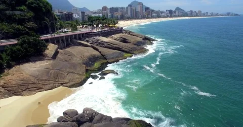 Aerial view along the road viewing the water and sun in Rio De Janeiro, Brazil. Stock-Footage 77735560