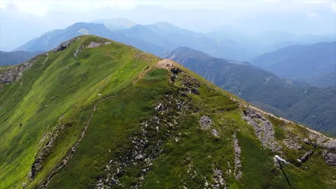 Aerial view along a steep alpine trail Stock Footage 322778933