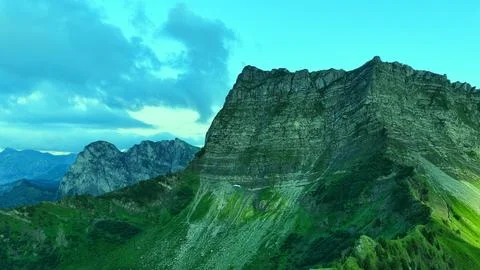 Aerial view of alpine cliff with dramatic sky and textures Stock Photos