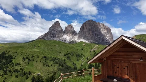 Aerial View of Alpine Hut Below Sassolungo Group, Passo Sella, Dolomites, Italy Stock Footage 339883075