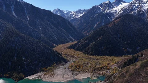Aerial view of alpine Issyk lake valley and snowy mountain range, Kazakhstan Vídeos de archivo 344099685