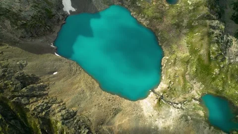 Aerial view of an alpine lake in the Caucasus mountains. Video stock 250892139