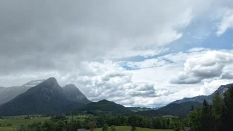 Aerial View of Alpine Mountains and Dramatic Clouds in Austria Stock Footage 335467515