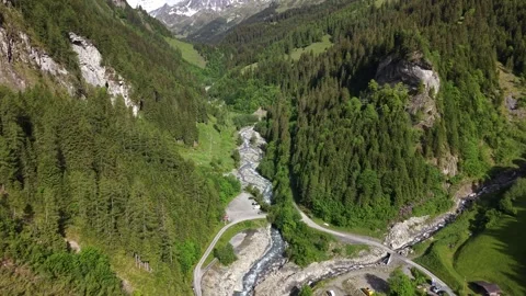 Aerial View of Alpine River Flowing Through Mountain Valley Stock Footage 336368288