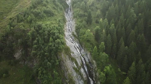 Aerial view of alpine Stuibenfall waterfall in Austria mountain river flowing Stock Footage 343736070