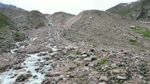 Aerial view of alpine valley and glacial stream in Kazakhstan Stock Footage 340454937
