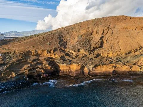 Aerial view of Amarilla Beach volcanic rocks at sunset, Tenerife Stock Photos