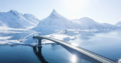 Aerial view of amazing arctic winter scenery with car passing bridge Stock Footage 108641153