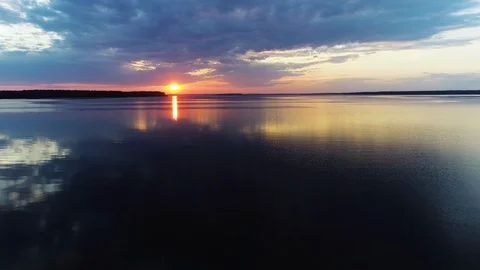 Aerial view. Amazing sky reflected in water. Beautiful sunset over the lake. Stock Footage 104019288