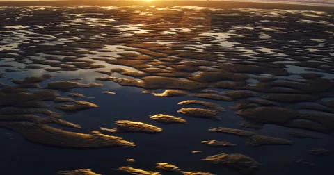 Aerial View of Amazing Sunset Reflection on Textured Beach Sand Tide Pools Video stock 63017546