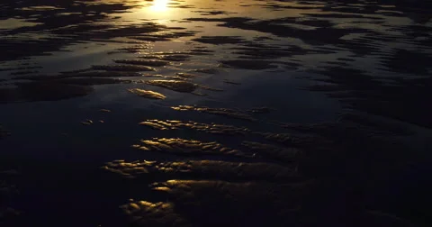 Aerial View of Amazing Sunset Reflection on Textured Beach Sand Tide Pools Stock Footage 63018420