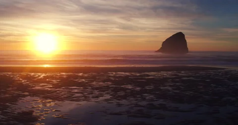 Aerial View of Amazing Sunset Reflection on Textured Beach Sand Tide Pools Video stock 63018692