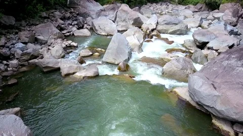 Aerial view of the Amazon jungle river rainforest. Water flowing through rocks. Stock Footage 76161381