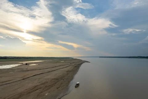 Aerial view of the Amazon river. Boat near the shore 写真素材