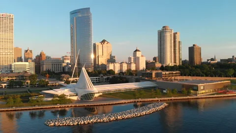 Aerial view of american city at dawn. High-rise  buildings, Milwaukee Art Museum Stock Footage