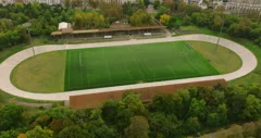 American football arena with yellow goal post, grass field and