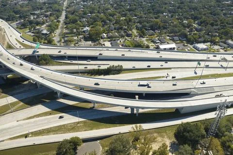 Aerial view of american freeway intersection with fast moving cars and trucks Stock Photos
