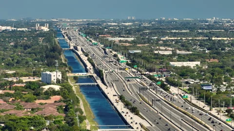 Aerial view of american freeway with many driving cars during rush hour in Miami Stock Footage 247398616