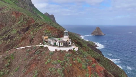 Aerial View of Anaga Lighthouse and Roque de Anaga on the Rugged Coast 스톡 동영상 344714525