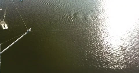 Aerial view of the anchorage of the cable car wake park, and an athlete cutting Stock Footage 171241670