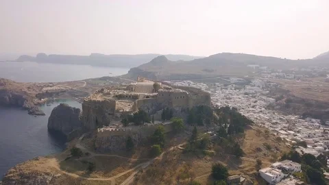 Aerial view of ancient Acropolis and village of Lindos Stock Footage 80614306