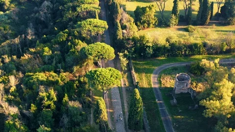 Aerial view of ancient Via Appia Antica with green trees, meadows, houses and Stock Footage