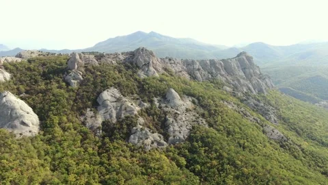 Aerial view. Ancient cliff slopes overgrown with forest. Natural background Stock Footage 169692727