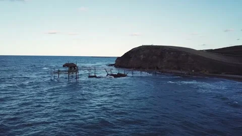 Aerial view - Ancient fishing machine built on the sea rock called Trabocco Stock Footage 215633545