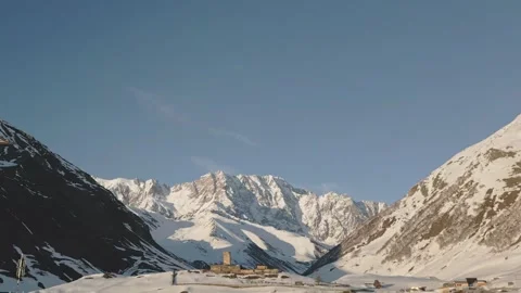 Aerial view ancient Lamaria Monastery in snowy highland valley, surrounded .. Vídeos de archivo 311998559
