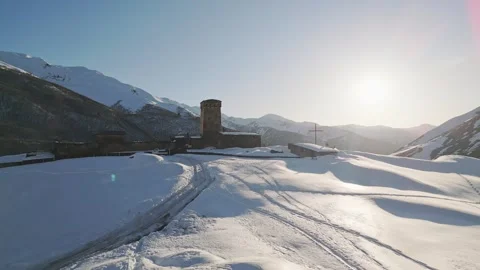 Aerial view Ancient Lamaria Monastery in snowy highland valley with Ushguli.. Vídeos de archivo 318297697