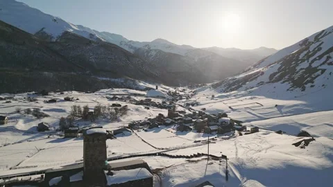 Aerial view Ancient Lamaria Monastery in snowy highland valley with Ushguli.. Stock-Footage 324949603